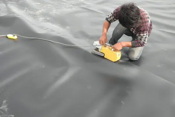 Geomembrane welding work affecting installed liner cost and seam quality