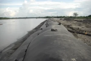 Geotextile tube used for shoreline protection and dewatering applications