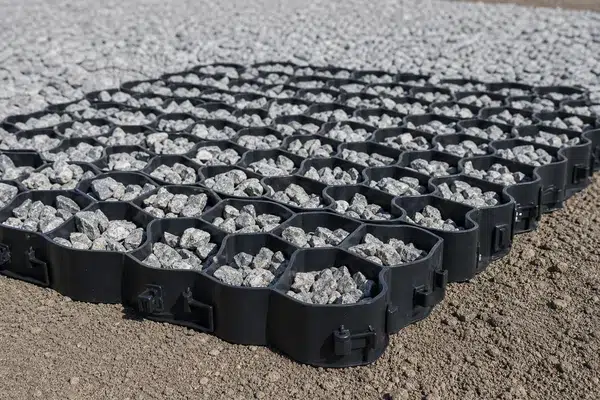 Illustrative open-cell HDPE grass paver filled with angular gravel for base and infill review