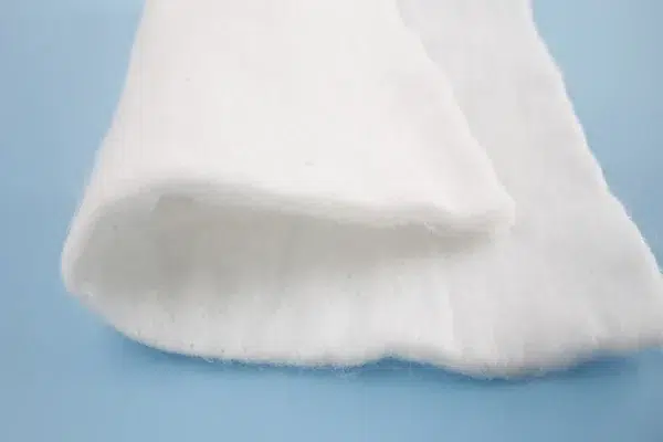 Nonwoven geotextile used as a pond liner protection and cushioning layer