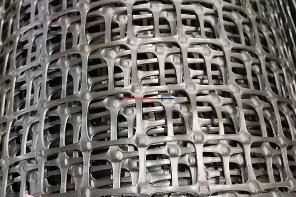 Close view of geogrid ribs and apertures for aggregate confinement review